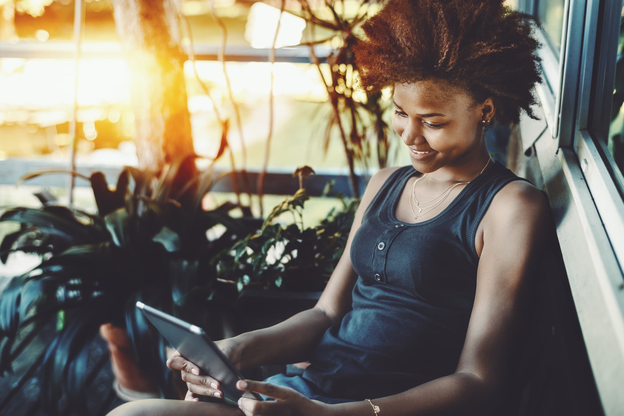 Teen reading on laptop